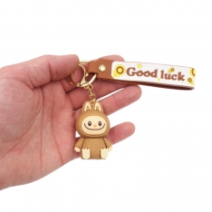 Raktų pakabukas su LABUBU figūrėle ir „Good Luck“ dirželiu